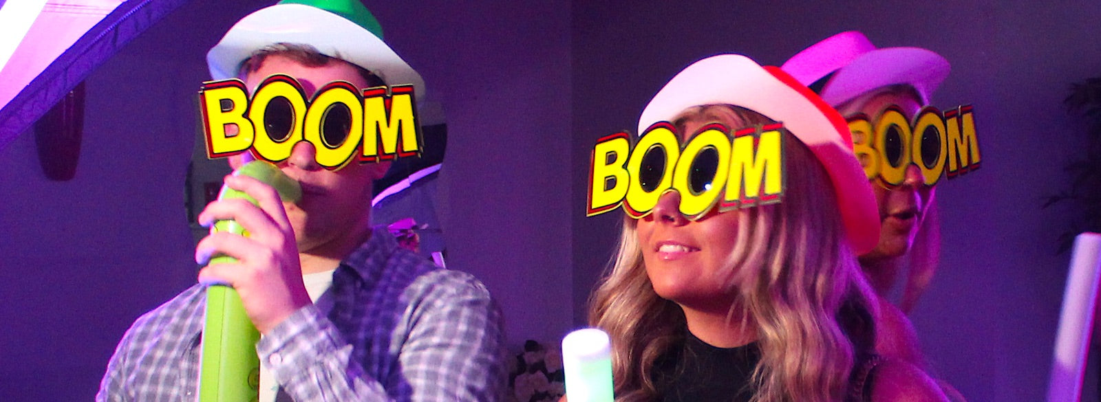 Man and woman wearing Boom glasses in a video booth