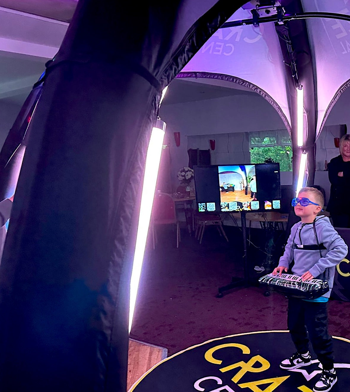 Boy in Craze Central's 360 photo booth in Gateshead at a party